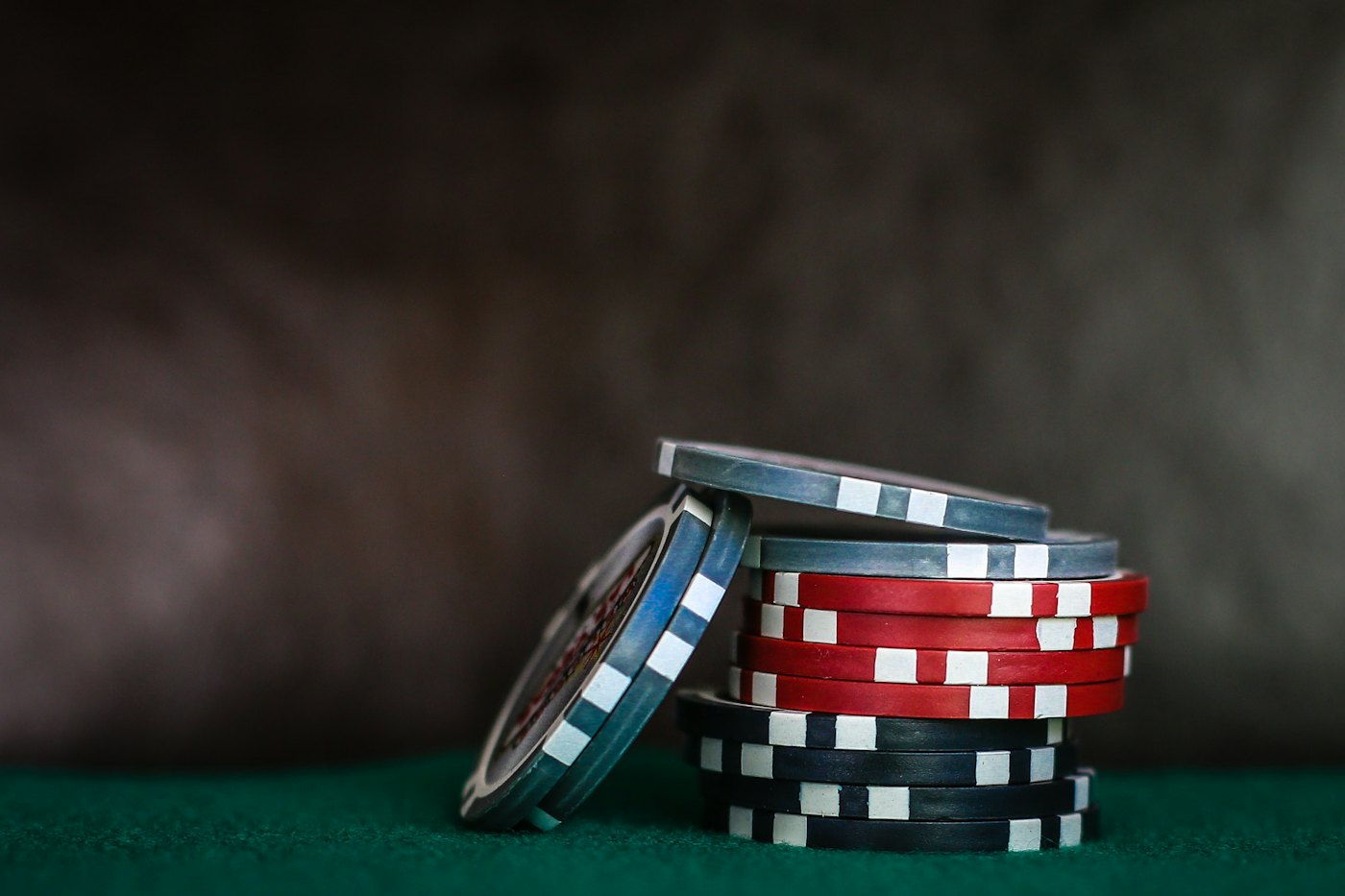 Stack of casino chips on green felt